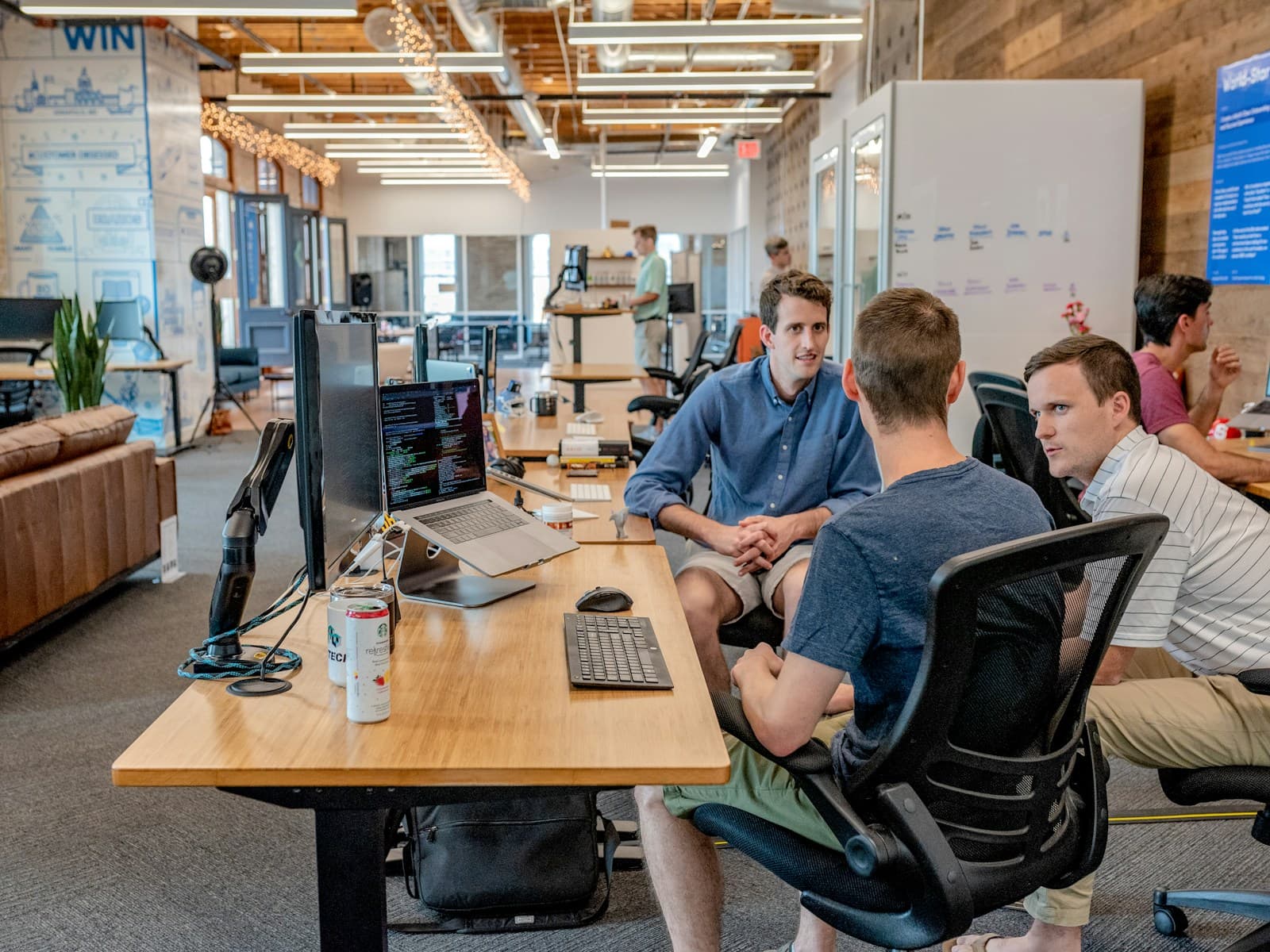 A team working together around a table in an operations workspace